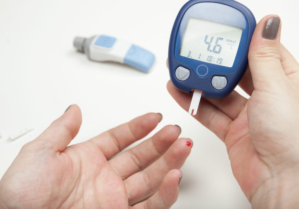 Woman Hands Testing High Blood Sugar With Glucometer